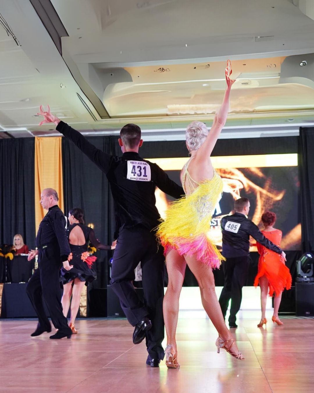 Tatiana Vaccaro dancing a lively Latin rhythm number on the competition floor
